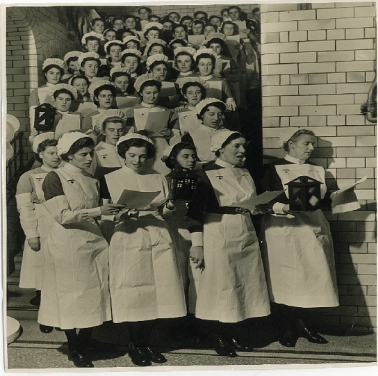 Women singing on stairs